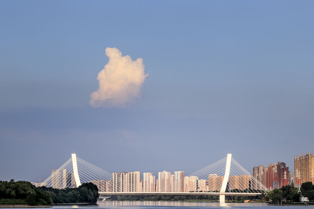 a large building with a cloud in the sky above it