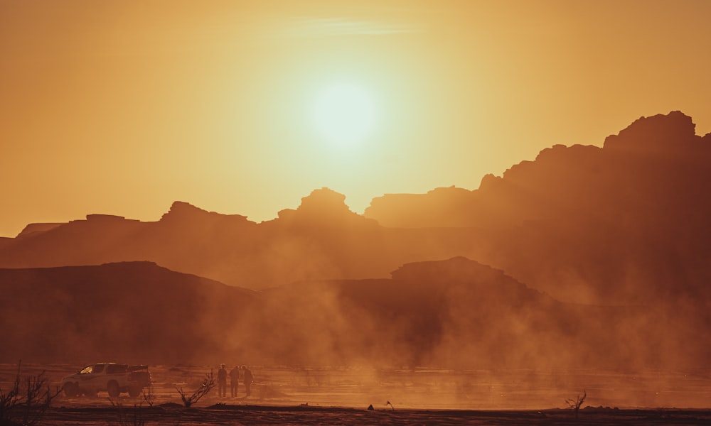 a sunset over a mountain range