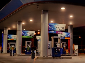 a gas station with signs