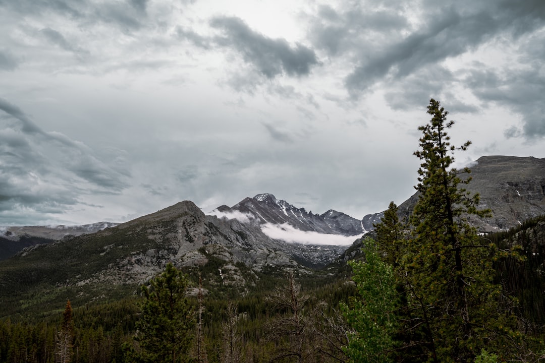 a snowy mountain range, A rainy day in the Rockies.