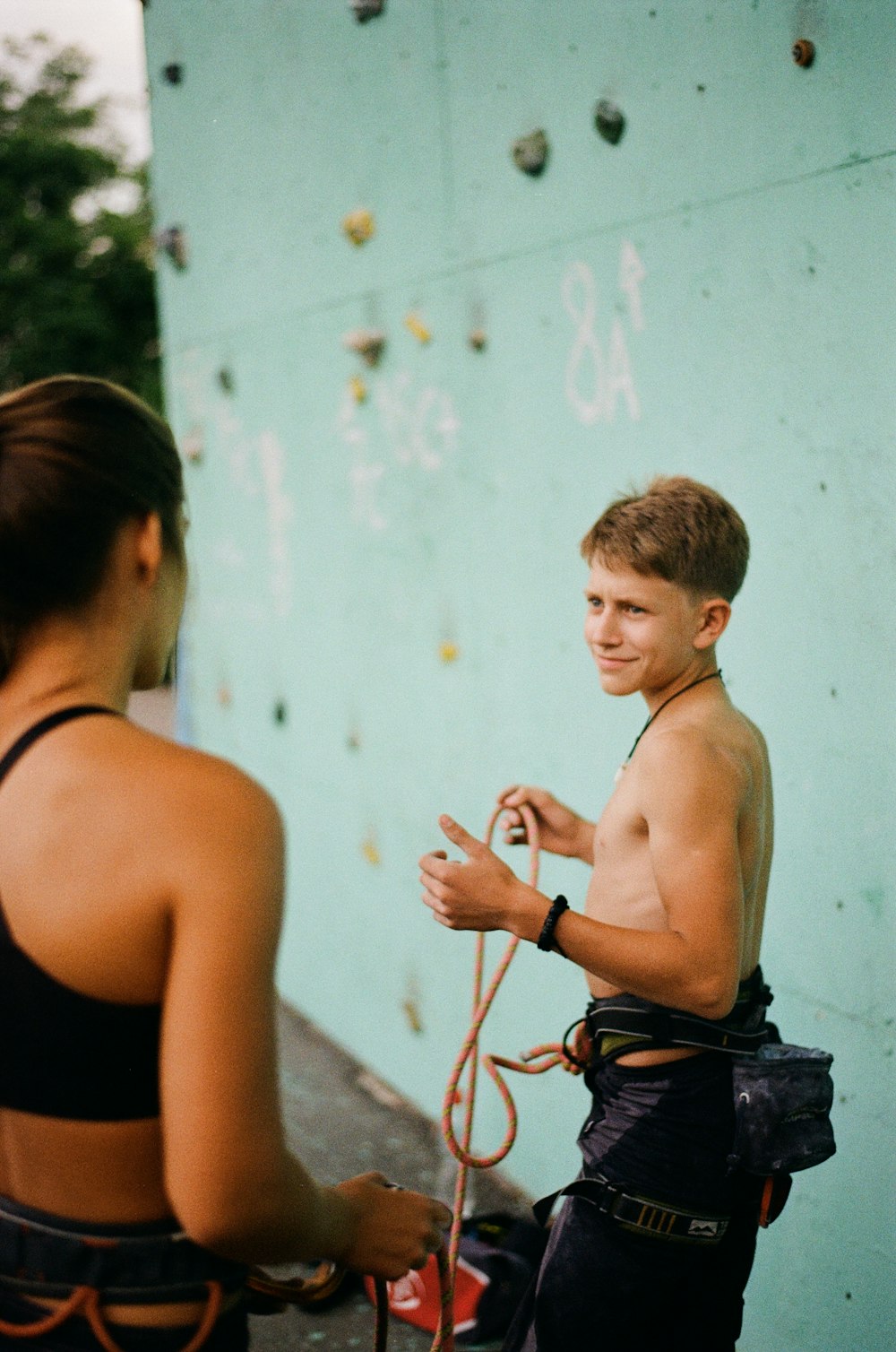 a boy painting a wall