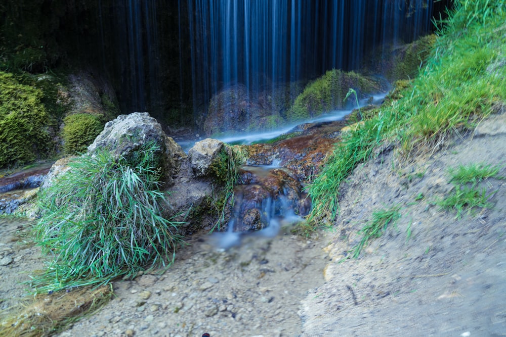 a small waterfall in a garden