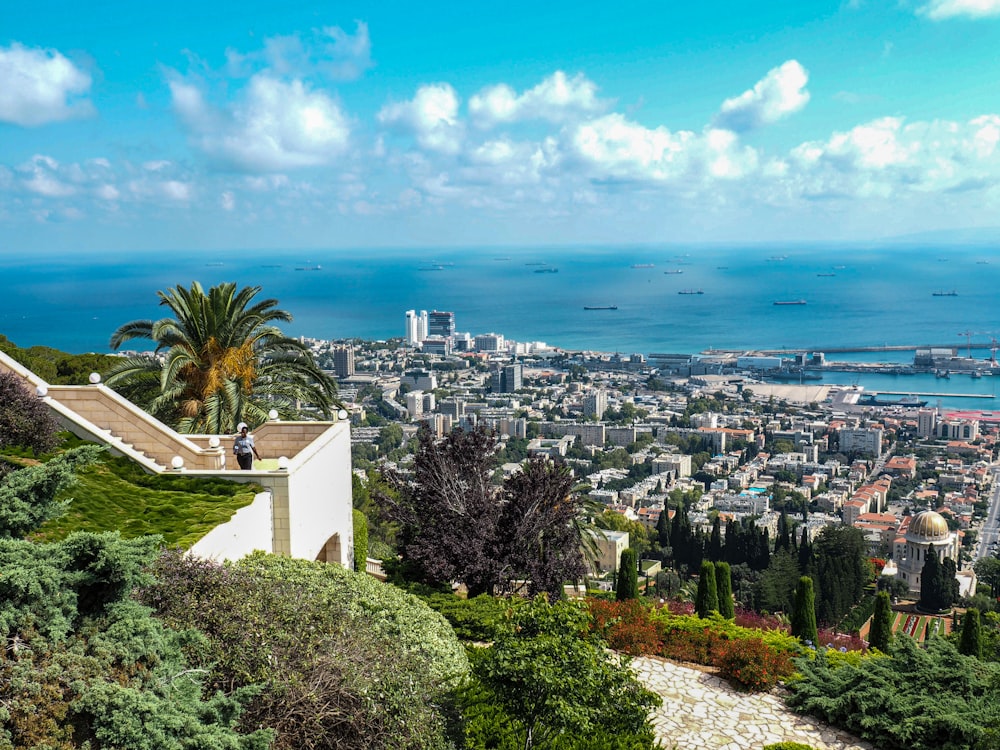 a city with a body of water in the background