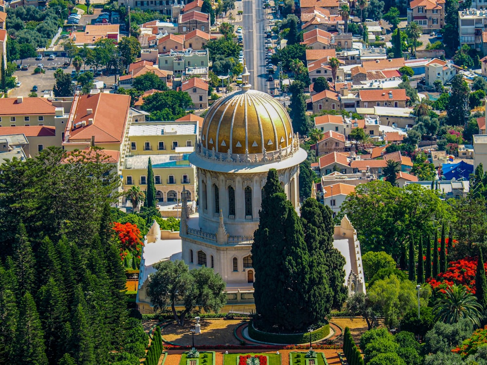 a large building with a dome surrounded by trees