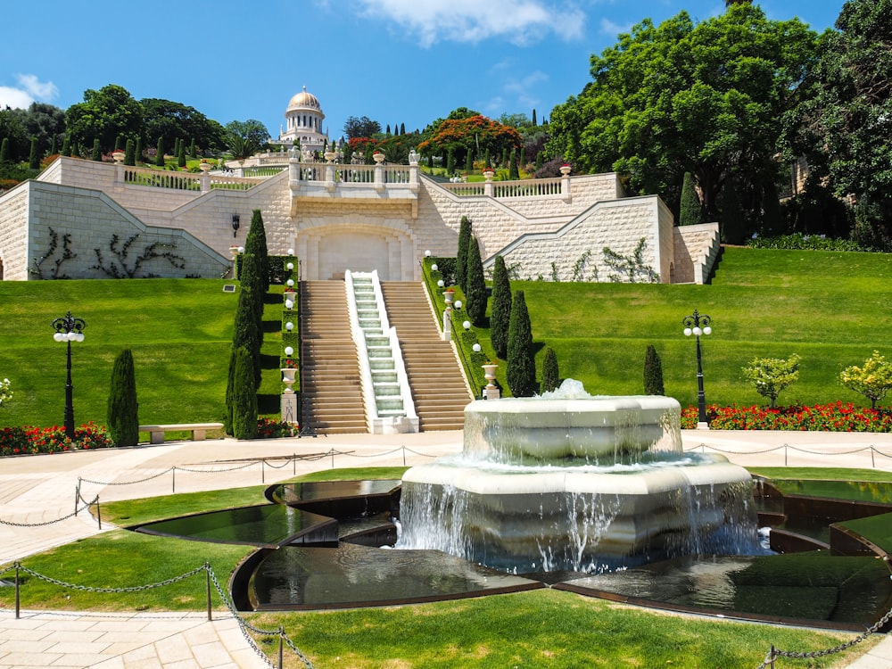 a large building with a fountain in front of it