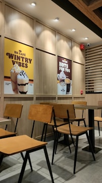 A colorful promotional poster featuring a cozy café setting with fresh coffee and pastries.