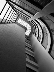 Architect reviewing building plans in a bright office with city view