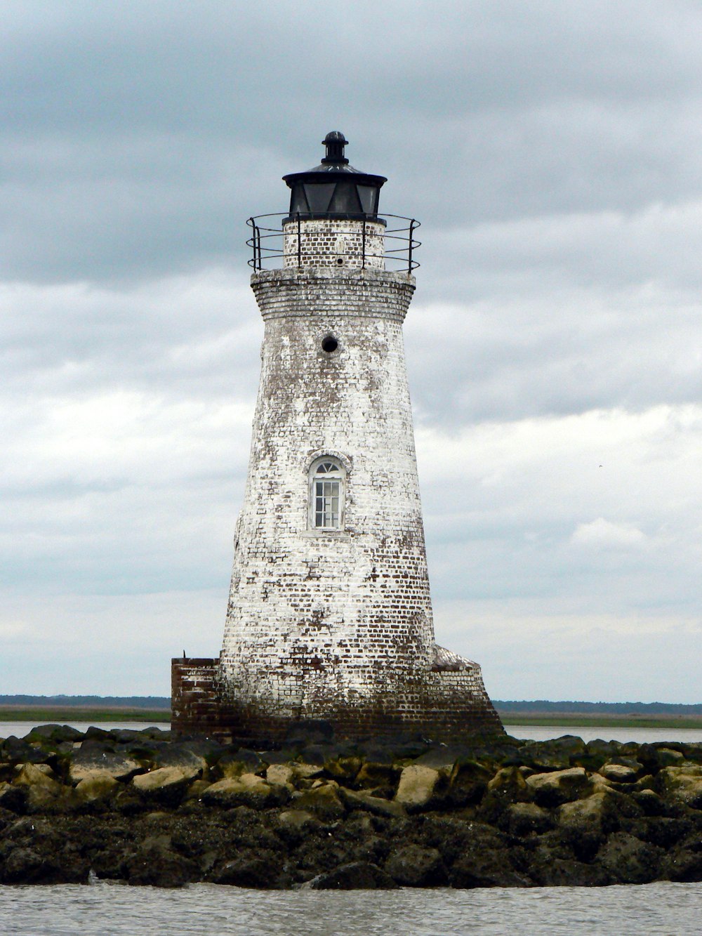 a lighthouse on a rocky shore