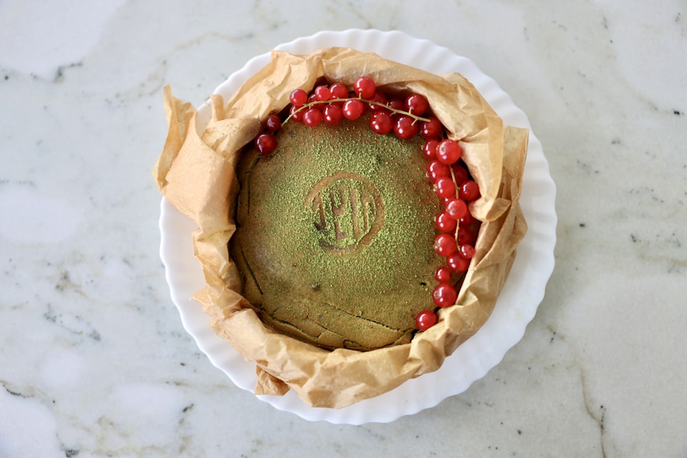 a decorated cookie on a white surface