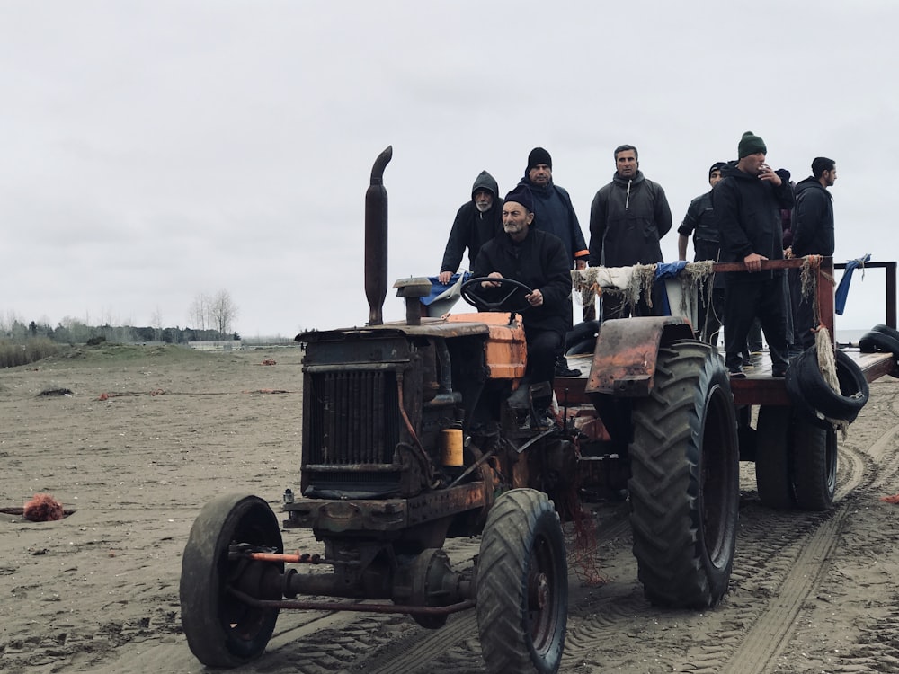 a group of people on a tractor