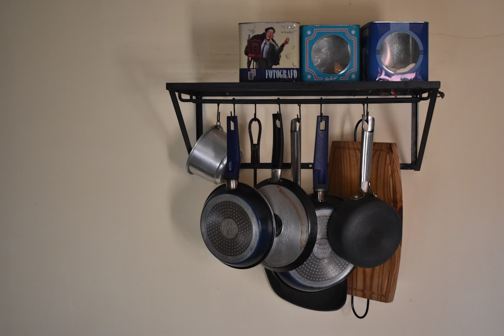 a shelf with pans and pans on it