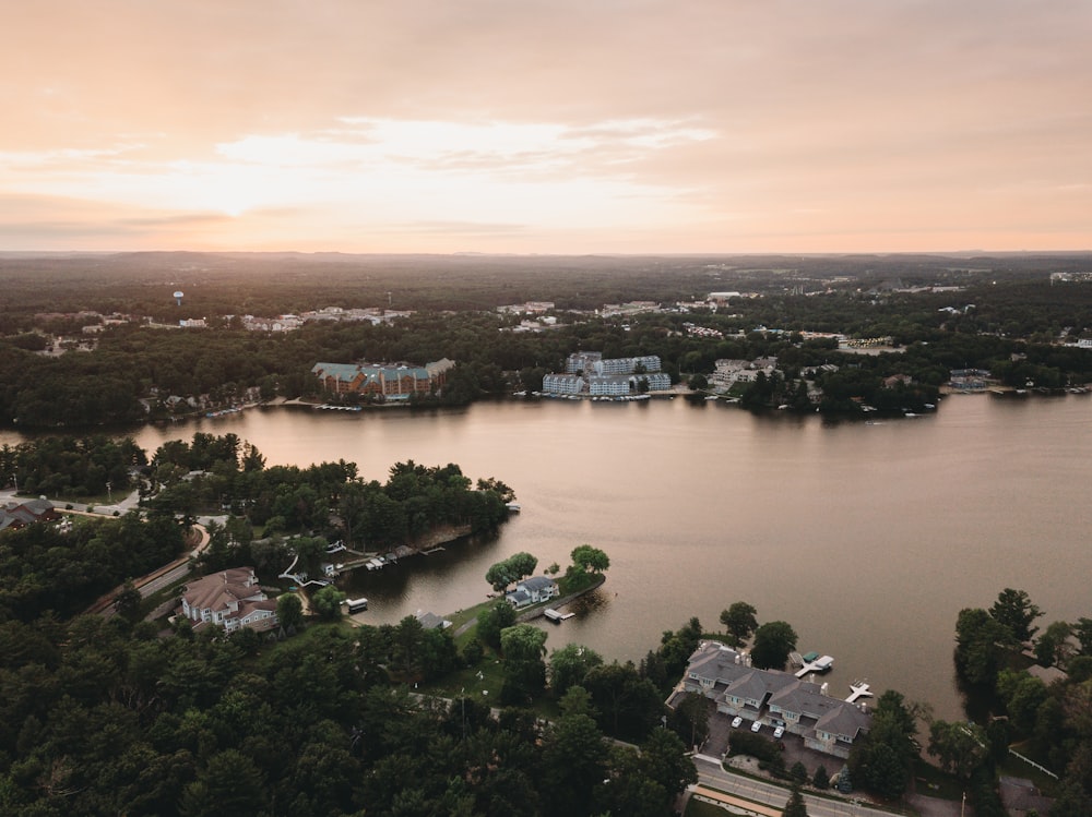 a body of water with buildings and trees around it