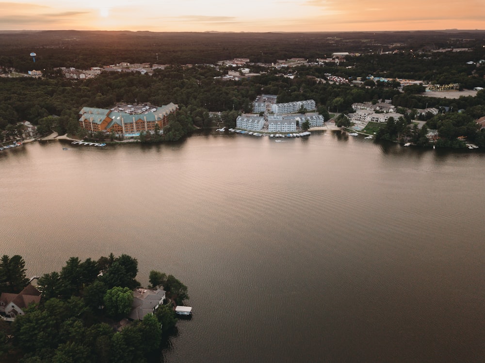 a body of water with buildings and trees around it