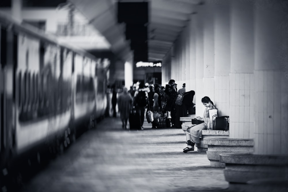 a group of people waiting for a train