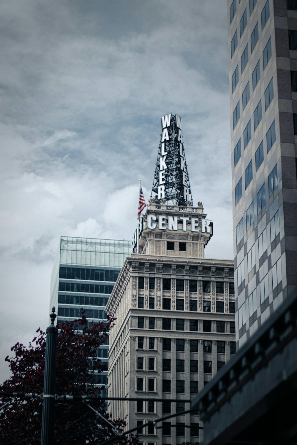 a tall building with a flag on top