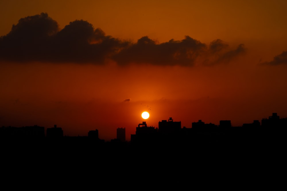 a sunset over a city