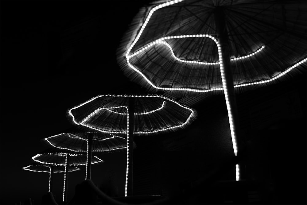 a couple of umbrellas in the dark