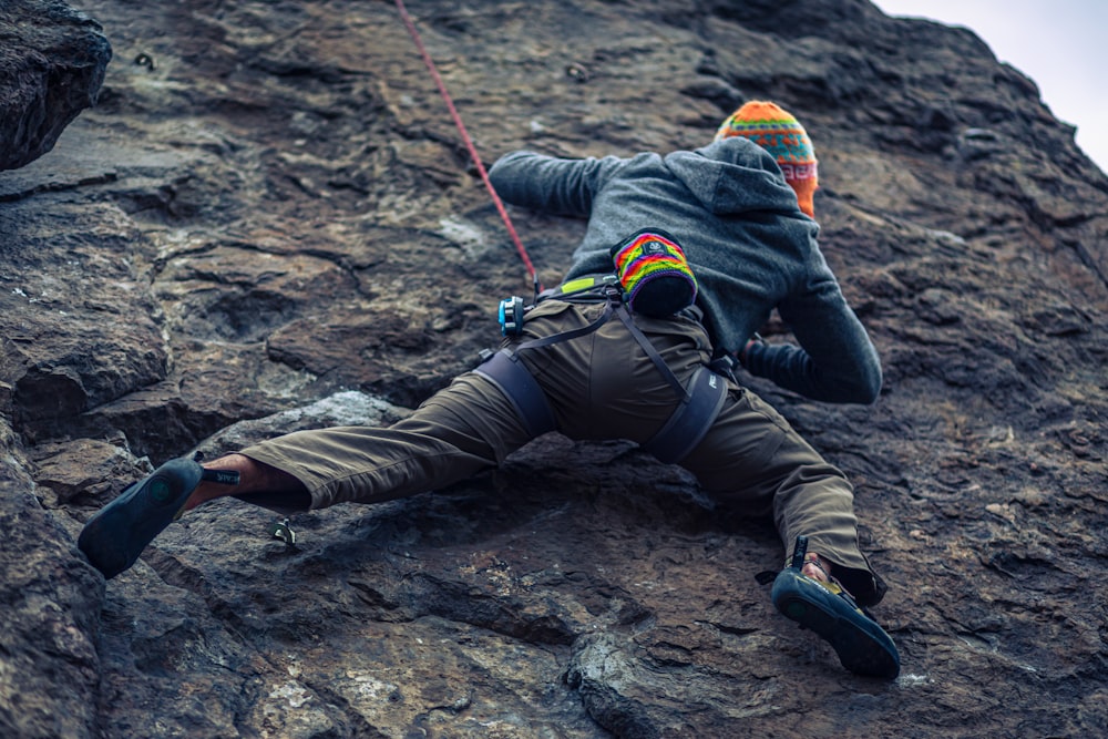 a person climbing a rock