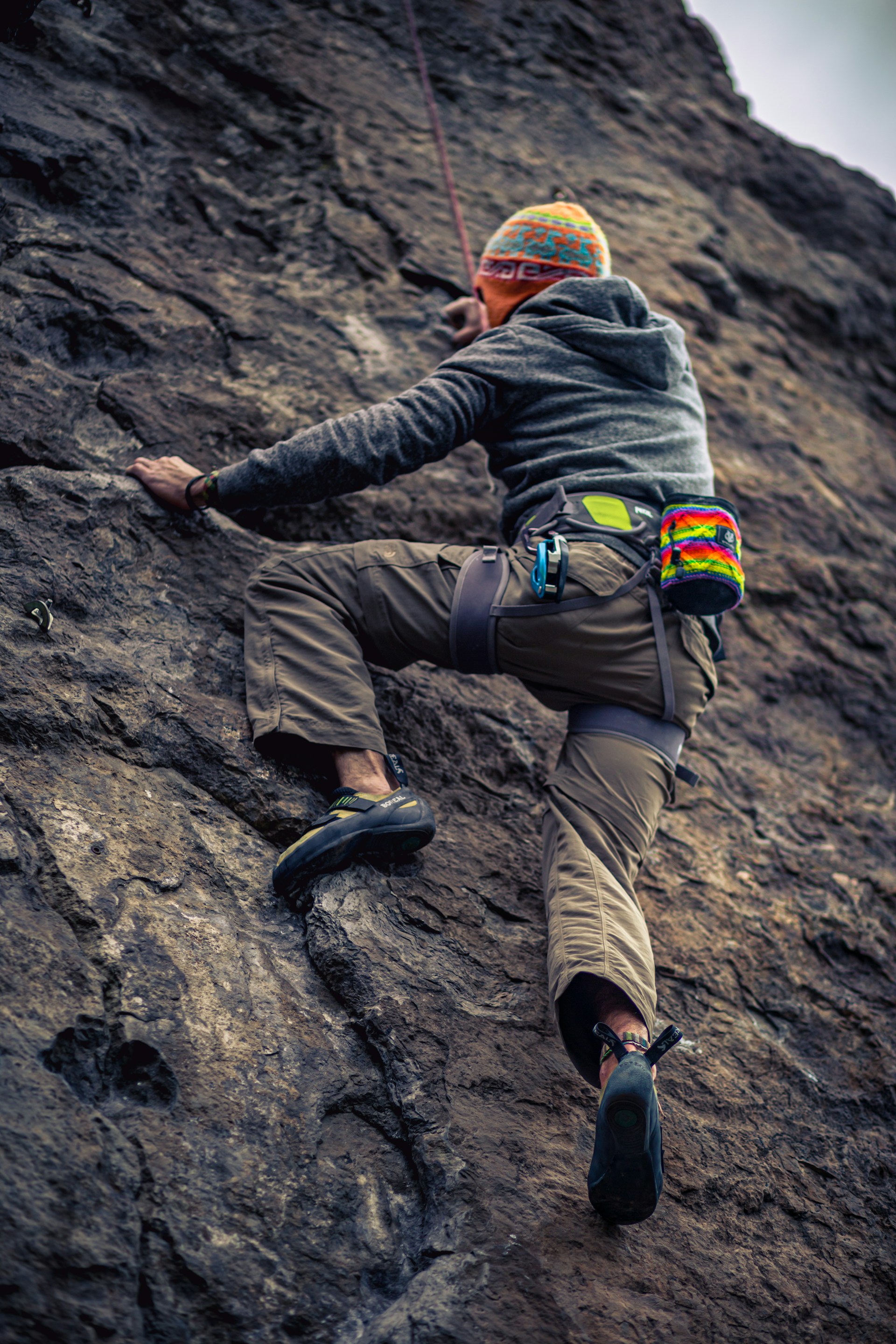 a man climbing a rock