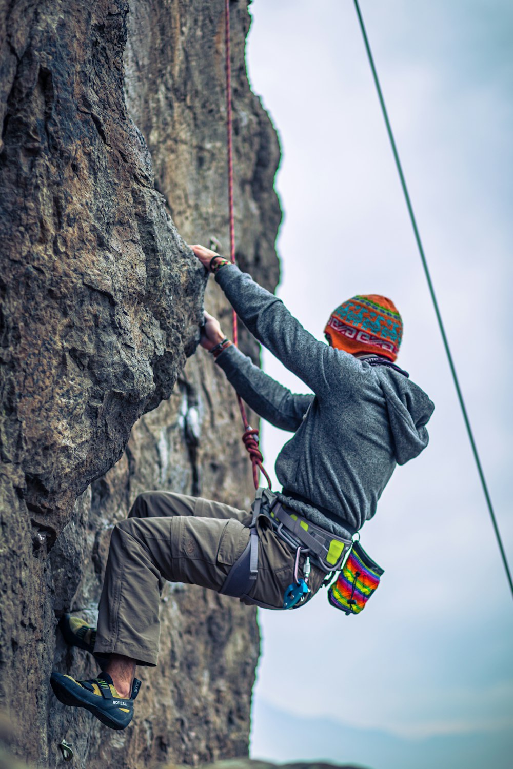 a man climbing a rock