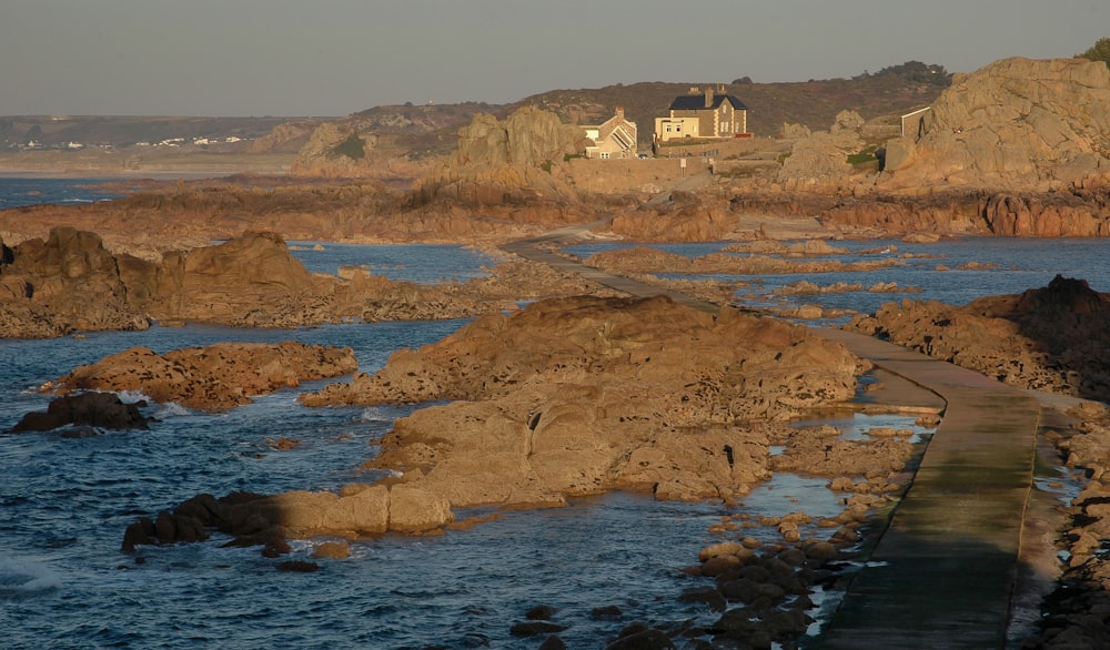 a beach with a house on it