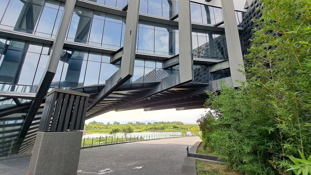 a building with a walkway and trees