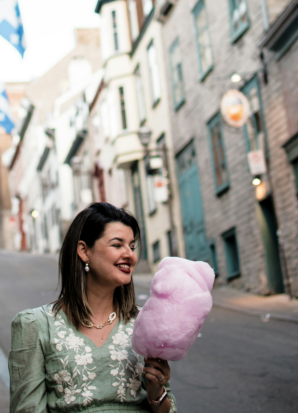 a woman holding a pink balloon