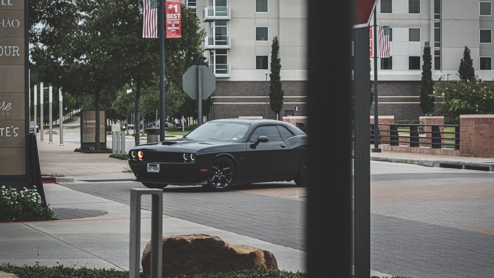 a black car parked on a street