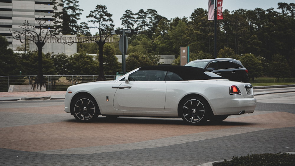 a white car parked on a street