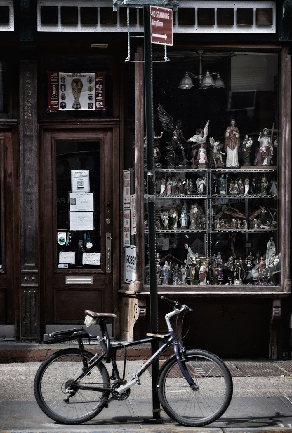 a bicycle parked in front of a store