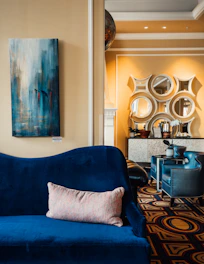 A modern living room wall freshly painted with deep blue interior paint.