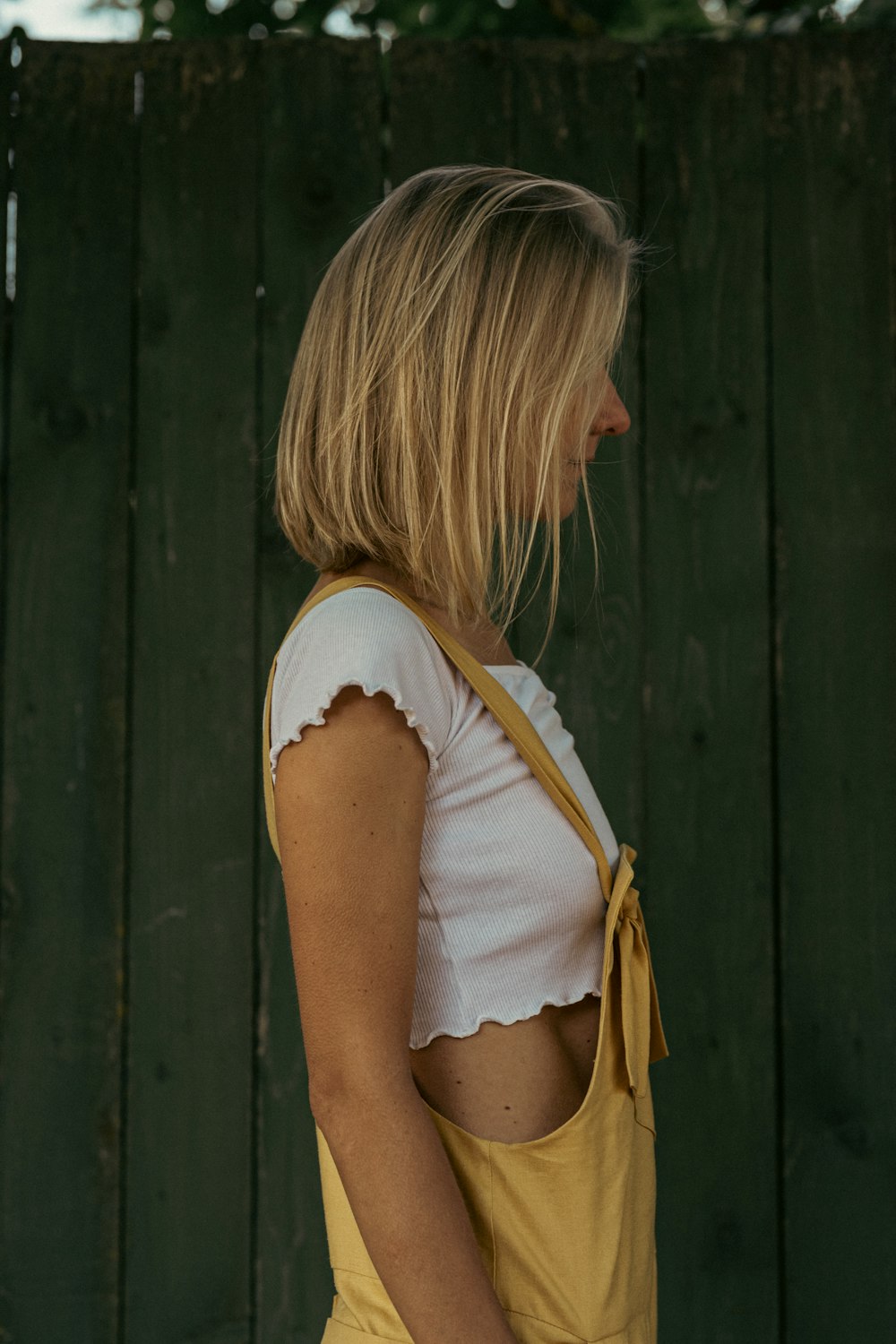 a person looking at a fence