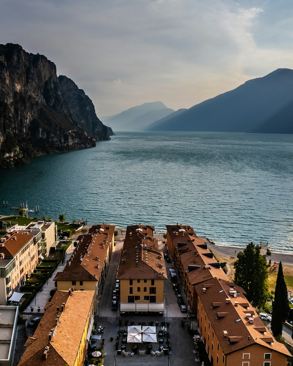 a bridge over a body of water with a mountain in the background