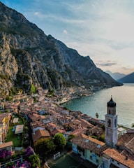 a bridge over a body of water with a mountain in the background