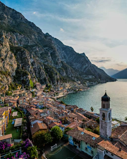 a bridge over a body of water with a mountain in the background