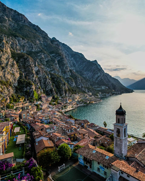 a bridge over a body of water with a mountain in the background