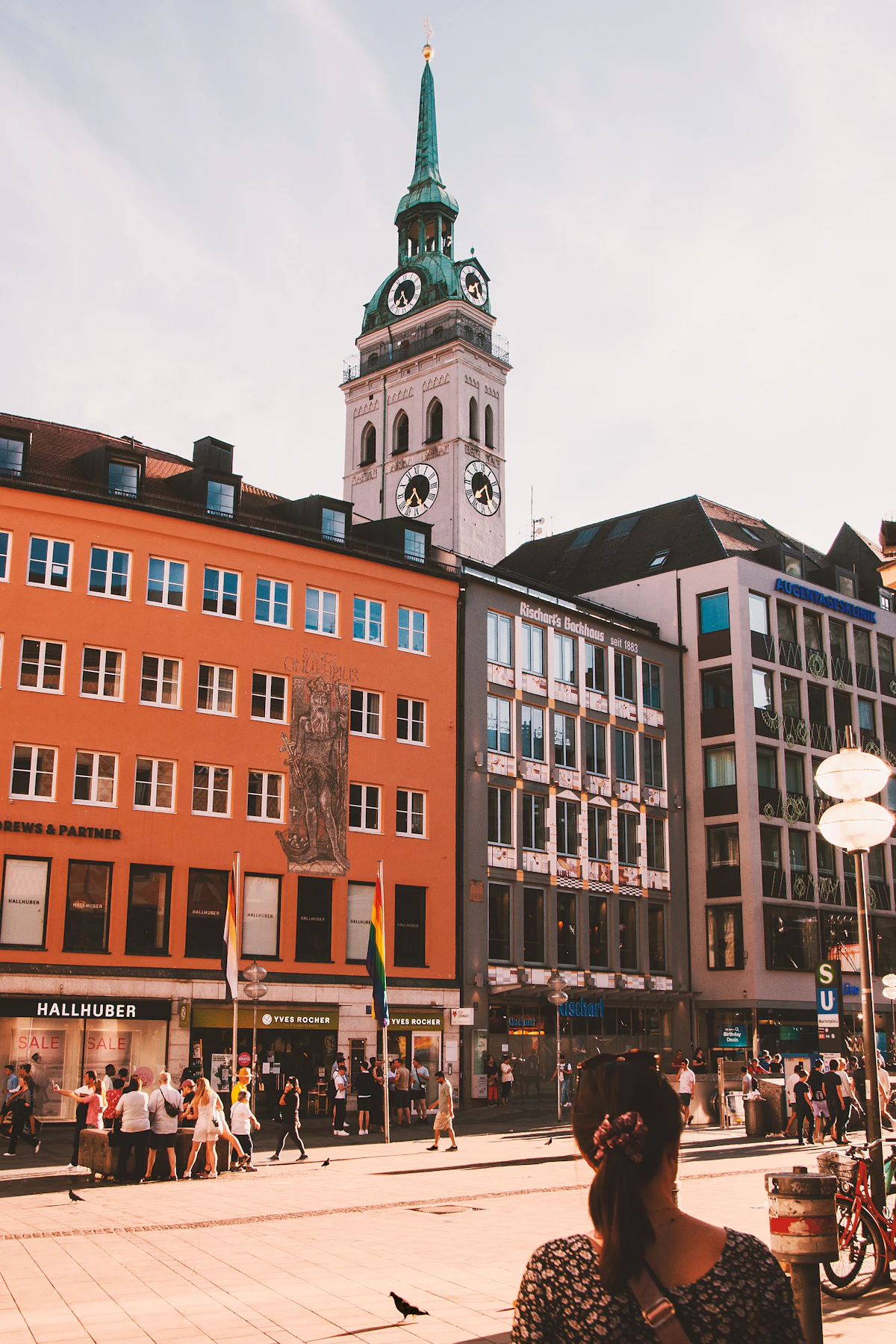 A street in central Munich with historic buildings and passing traffic