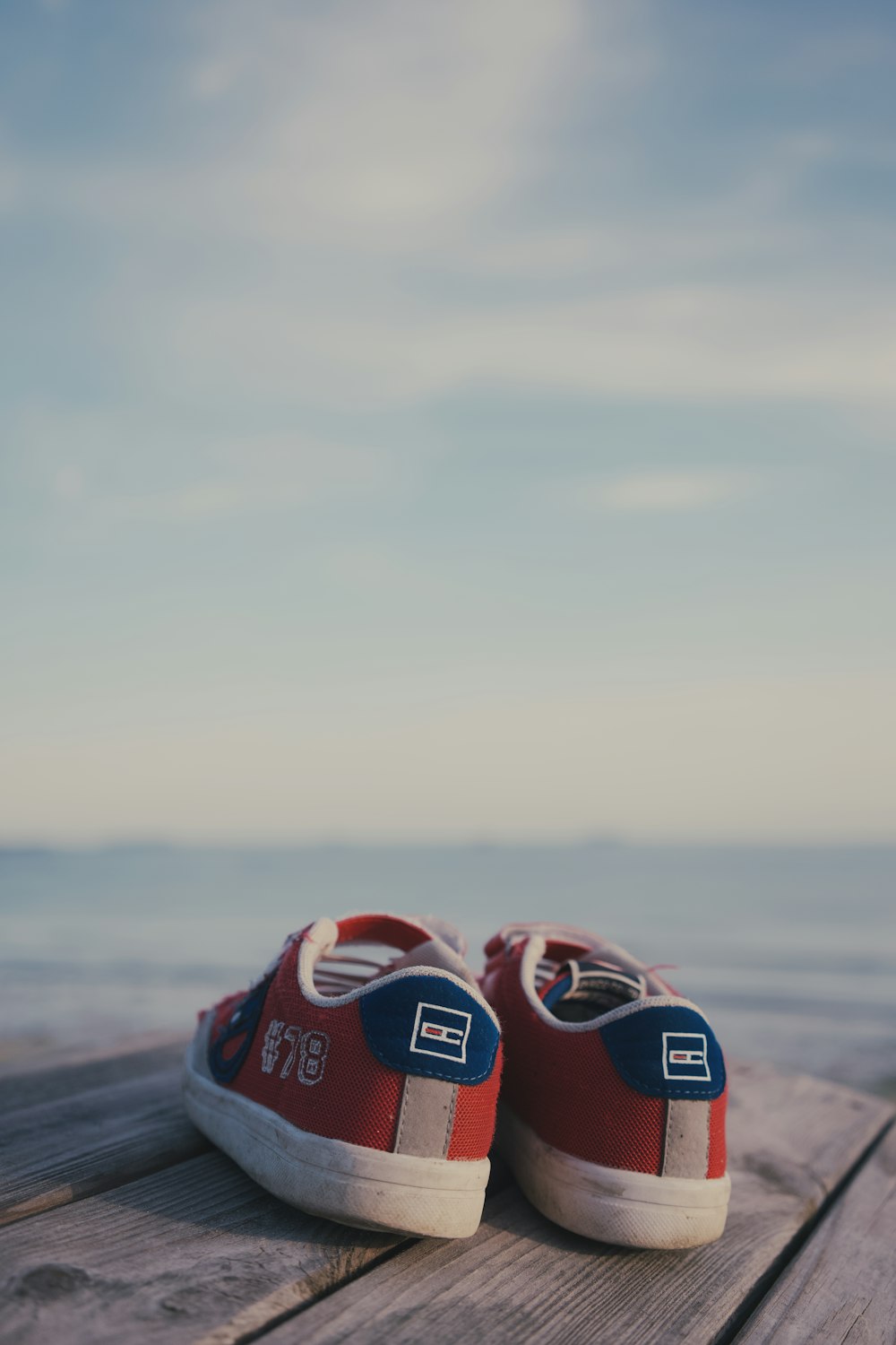 a group of shoes on a wood surface