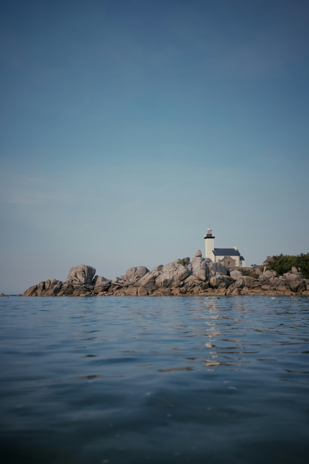 a lighthouse on a rocky island