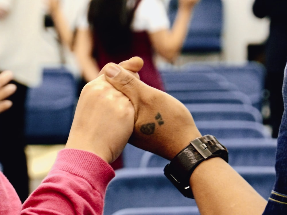 a person's hand with a tattoo on it