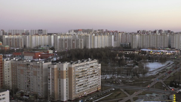 A panoramic view of a large prefabricated residential complex with steel structures in an urban setting