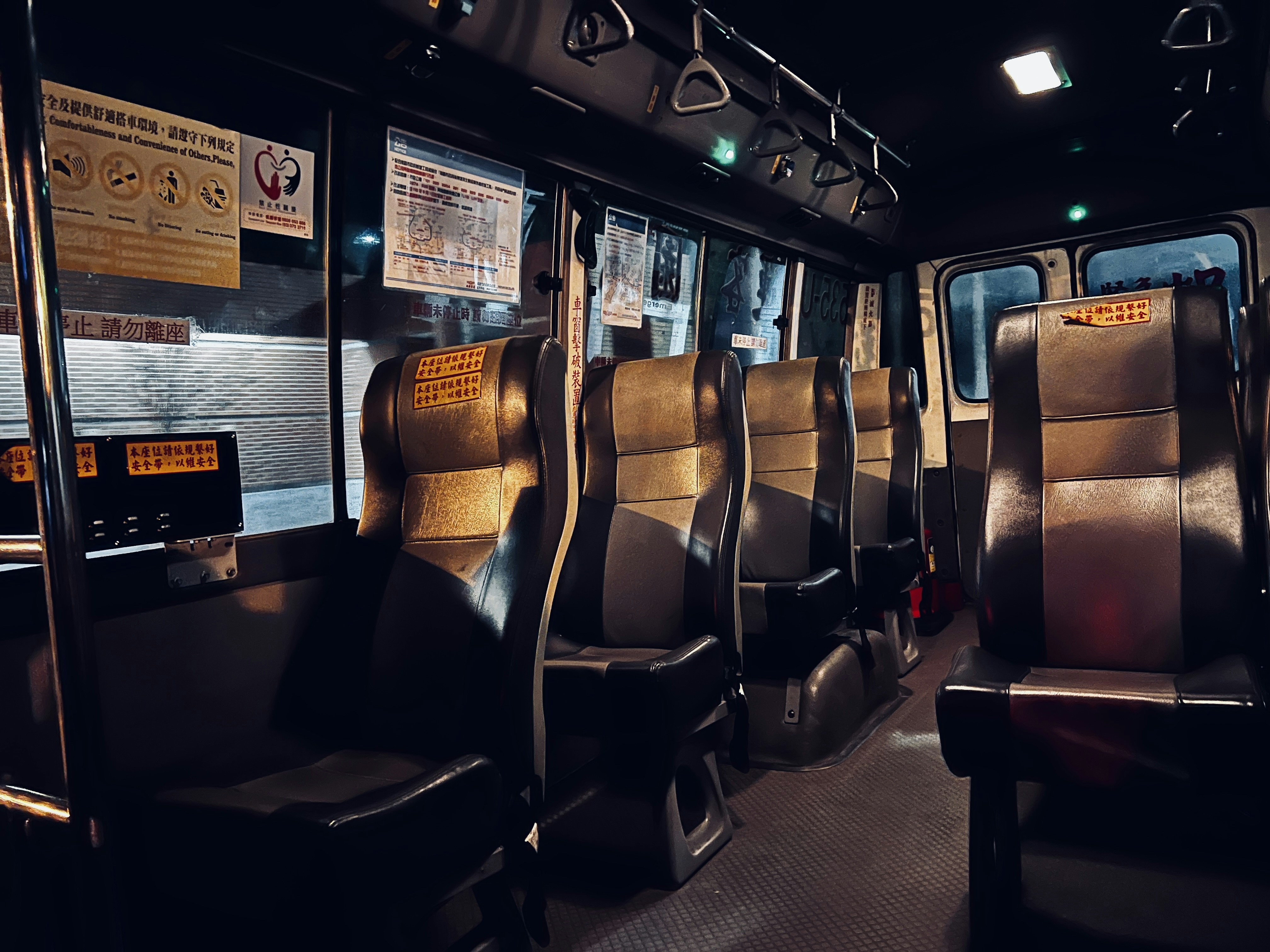 Interior of a luxury charter bus showcasing plush seating and entertainment systems