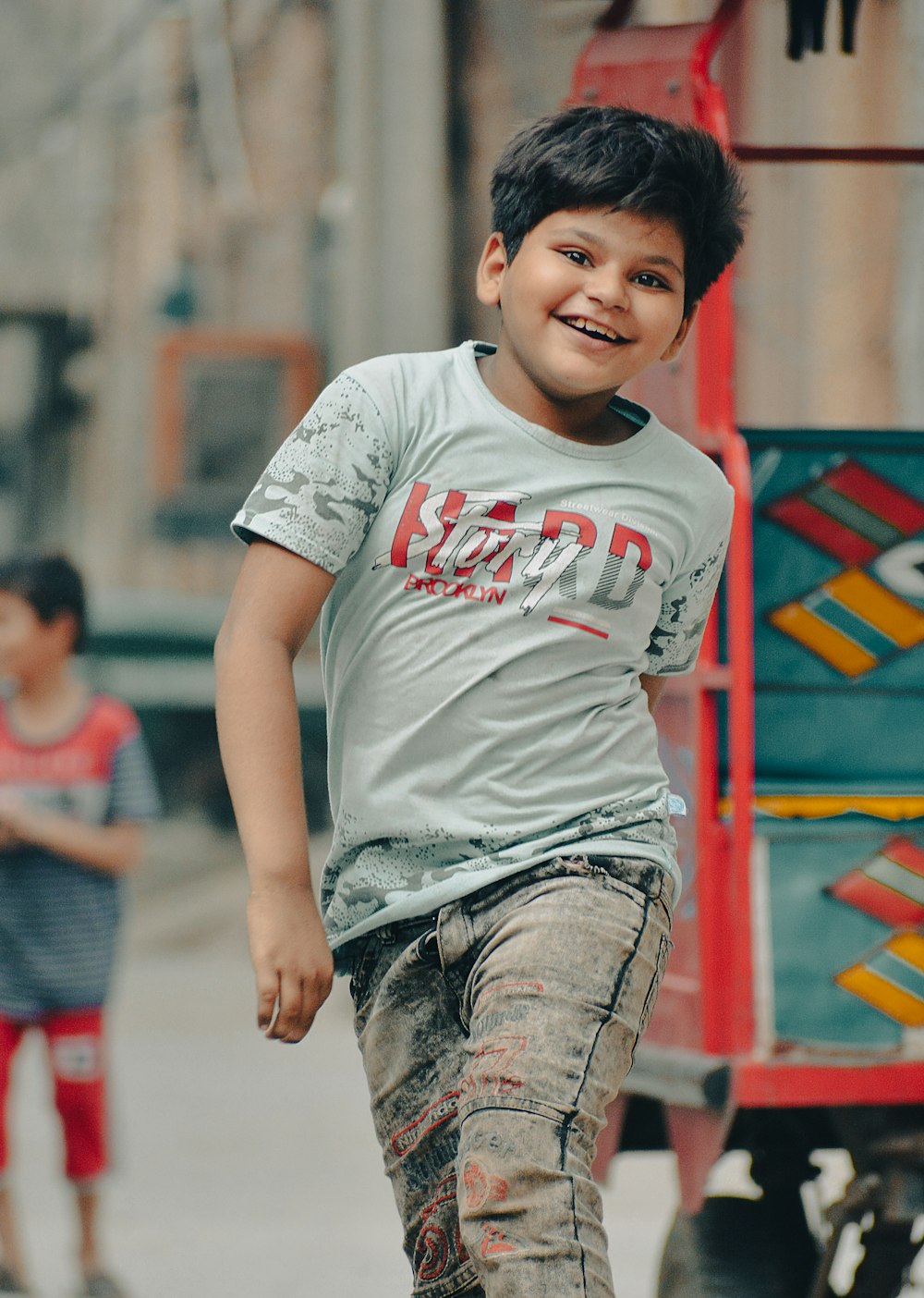 a boy smiling at the camera
