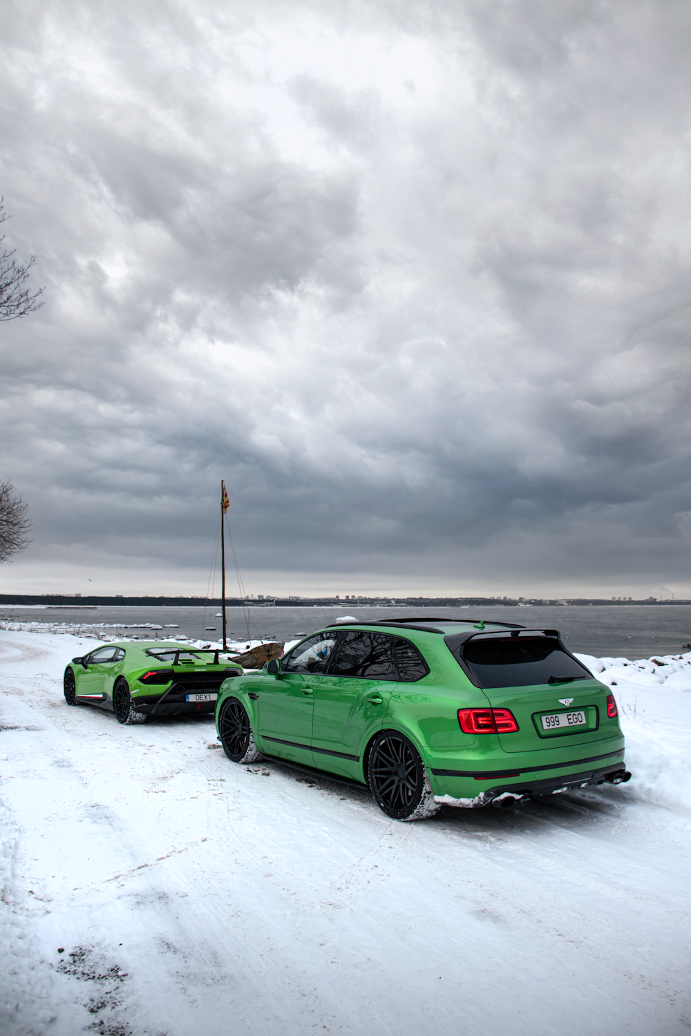 two cars parked in a snowy area