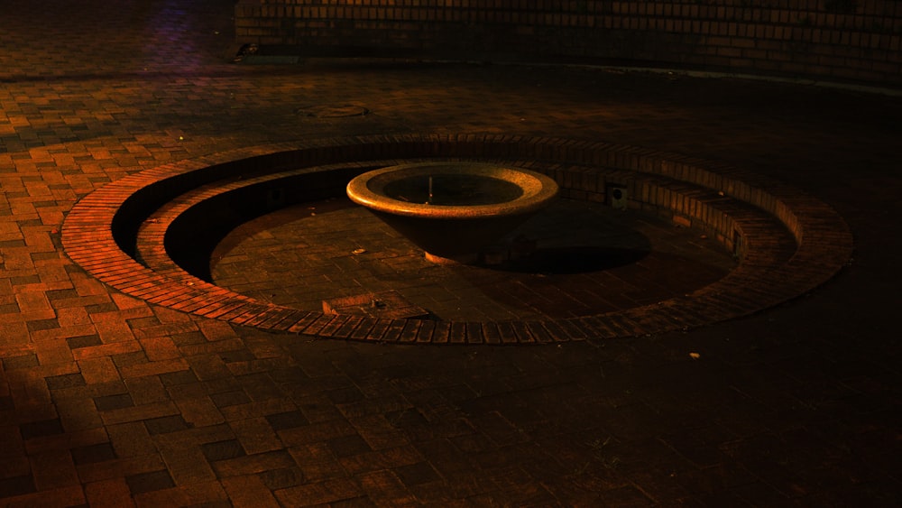 a circular hole in a brick surface