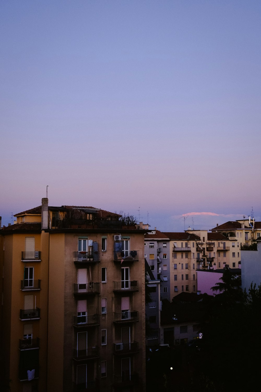 a group of buildings with a blue sky