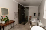 a bathroom with a tub sink and toilet