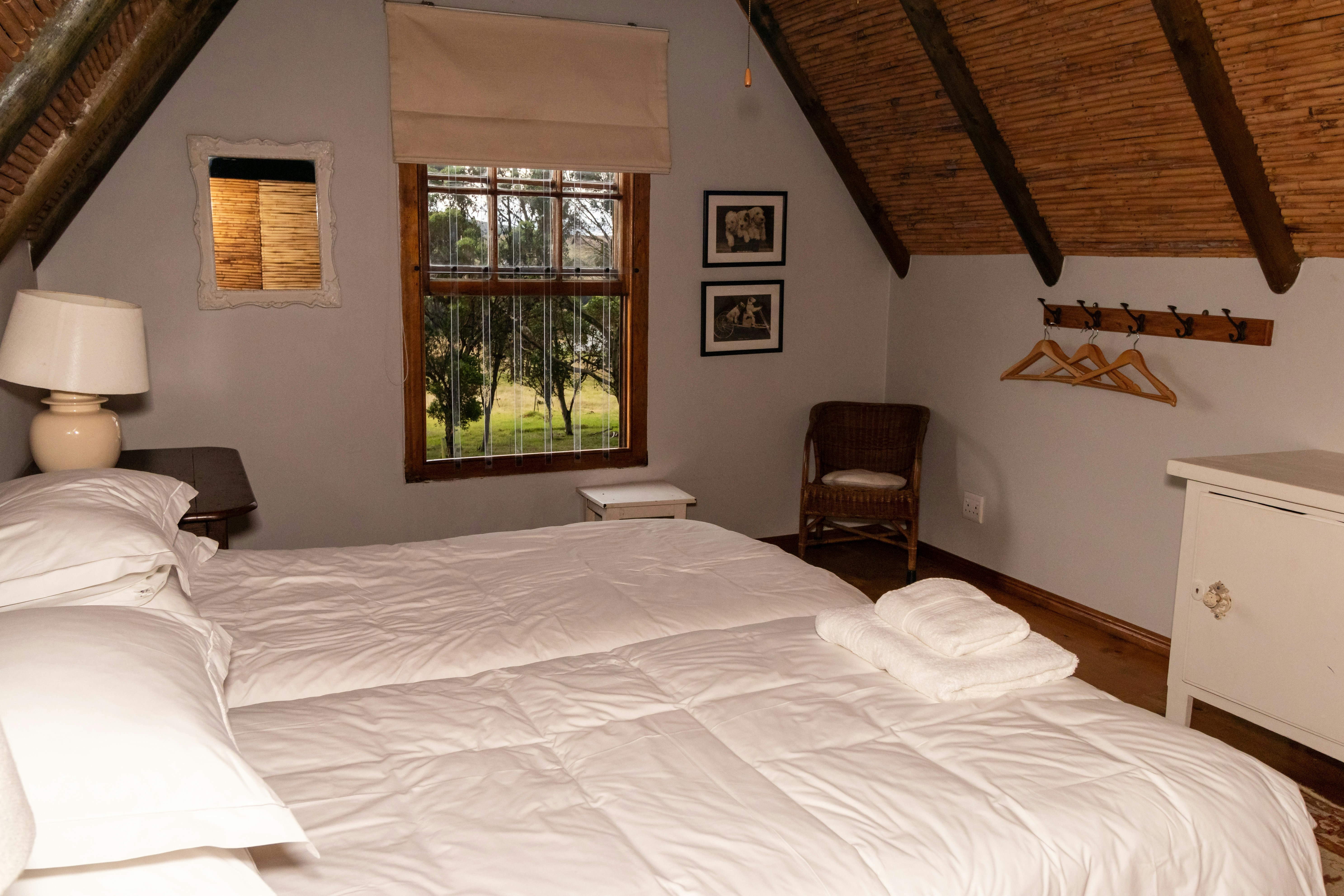 a bedroom with a bed and a chair