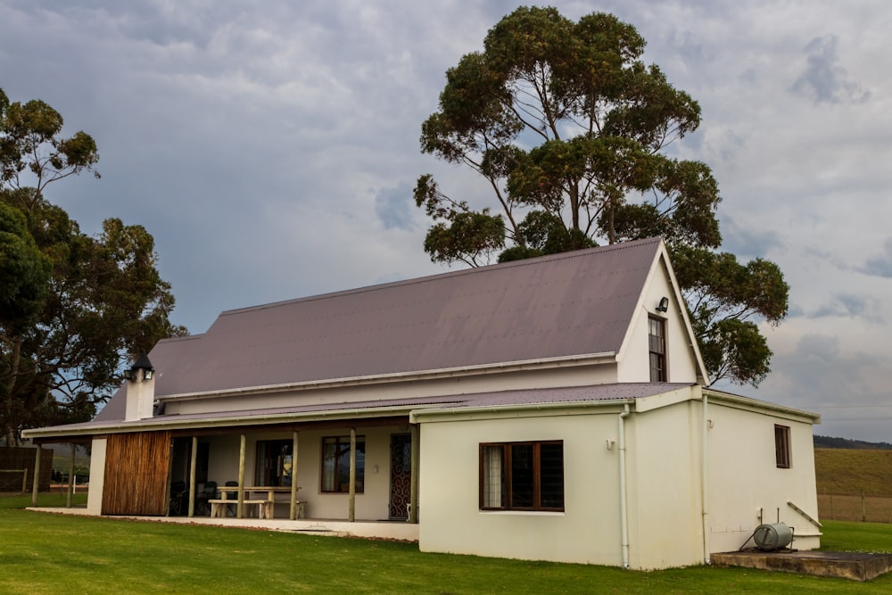 a house with a lawn and trees