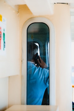 A counselor speaking compassionately with a veteran over the phone.